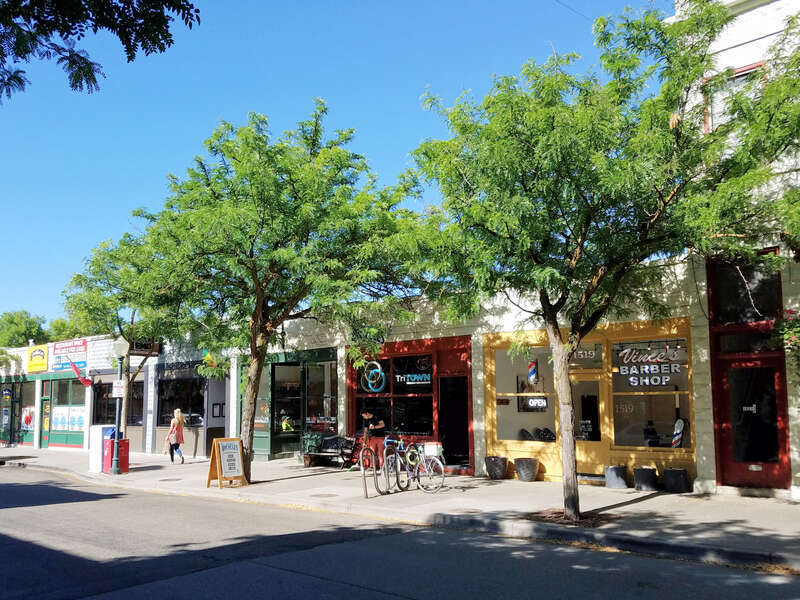 The row of single story, adjacent commercial buildings between West Alturas Street and West Eastman Street was constructed in 1907 and 1909 and is part of the Hyde Park Historic District in Boise, Idaho.