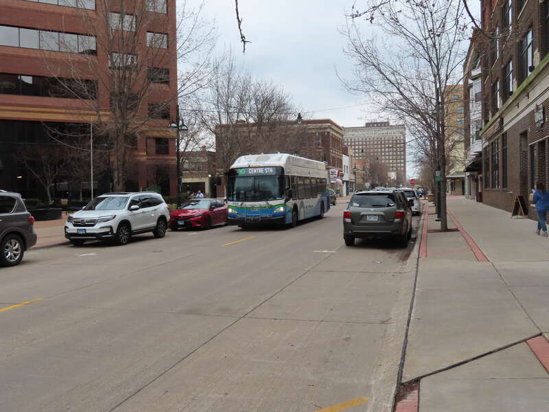 Quad Cities MetroLINK 1602, a 2016 New Flyer XN40, operates Route 30 on 5th Ave in Moline, Illinois