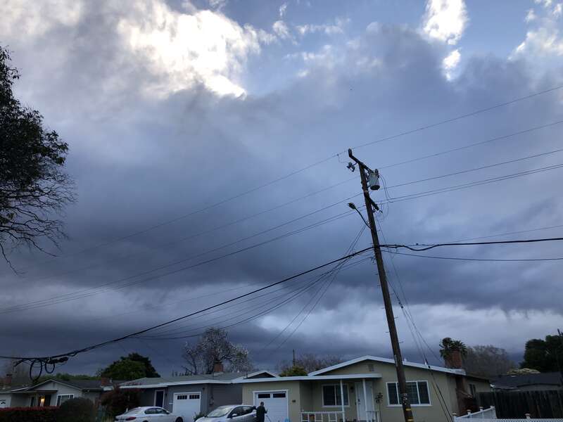 Approaching storm clouds from a Pacific storm system viewed from East Duane Avenue at Kirk Avenue in Sunnyvale, Santa Clara County, California