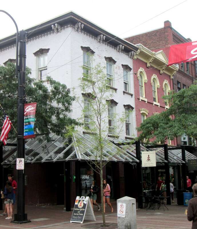 80 Church Street on the corner of Bank Street, known as the Fisher Block (left), and 82-84 Church Street, known as the Mooney Block (right), in the Church Street Marketplace of downtown Burlington, Vermont.80 Church Street was built c.1865 in the