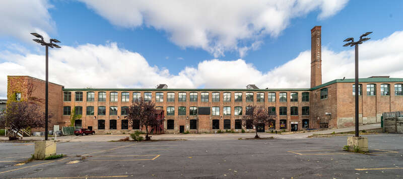 Amphion Piano Player Factory, south facade. Syracuse New York, viewed from parking lot.