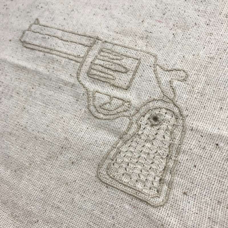 Shannon Downey aka Badass Cross Stitch created several dozen fiber-based guns and launched a global craftivism project around gun violence. The project featured over 200 fiber-based guns created and submitted from artists around the world. There was