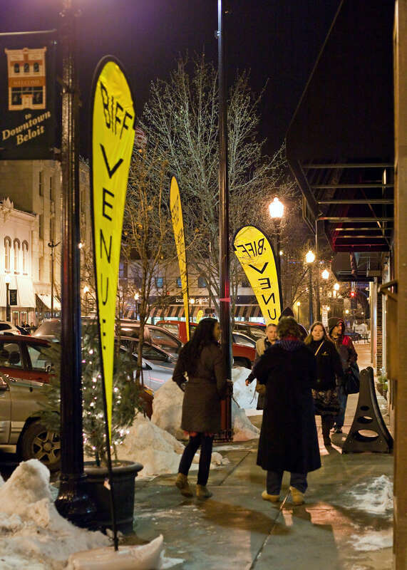 Film festival attendees can easily walk from one screening venue to another in downtown Beloit WI. Festival patrons walking east on Grand Ave. during the Beloit Film Festival.