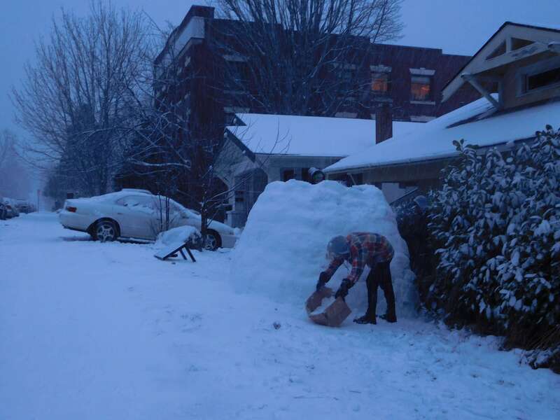 Building an igloo on High Street, Bellingham, Washington