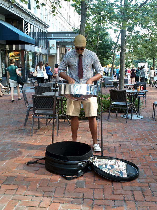 A busker plays a steel drum outside of the 19th Street entrance to the Dupont Circle Metro station in Washington, DC.

Ben Schumin is a professional photographer who captures the intricacies of daily life.  This image may be used under Creative