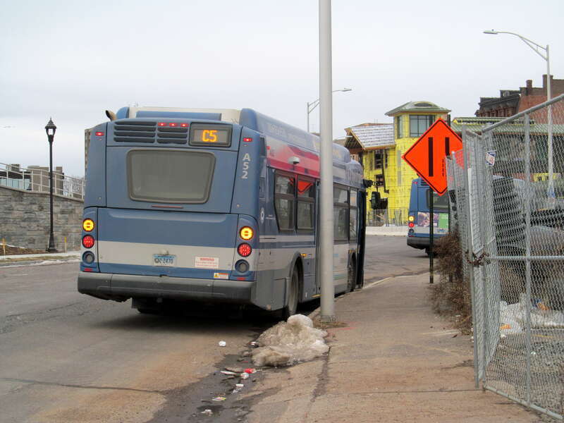 CT Transit route C5 bus in Meriden in December 2016, with construction of the new Meriden station in the background