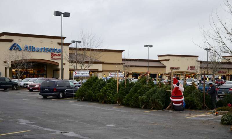 A Christmas tree lot in Hillsboro, Oregon, in the parking lot of an Albertsons-anchored strip mall at the intersection of Cornelius Pass Road and Baseline Road.