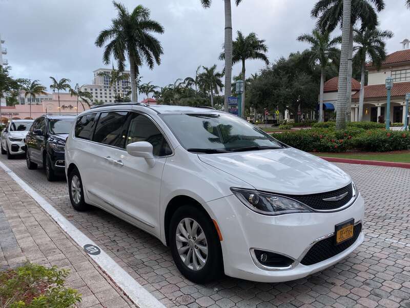 Chrysler Pacifica minivan (RU) in finished white. Photographed while parked at Mizner Park, Boca Raton, Florida