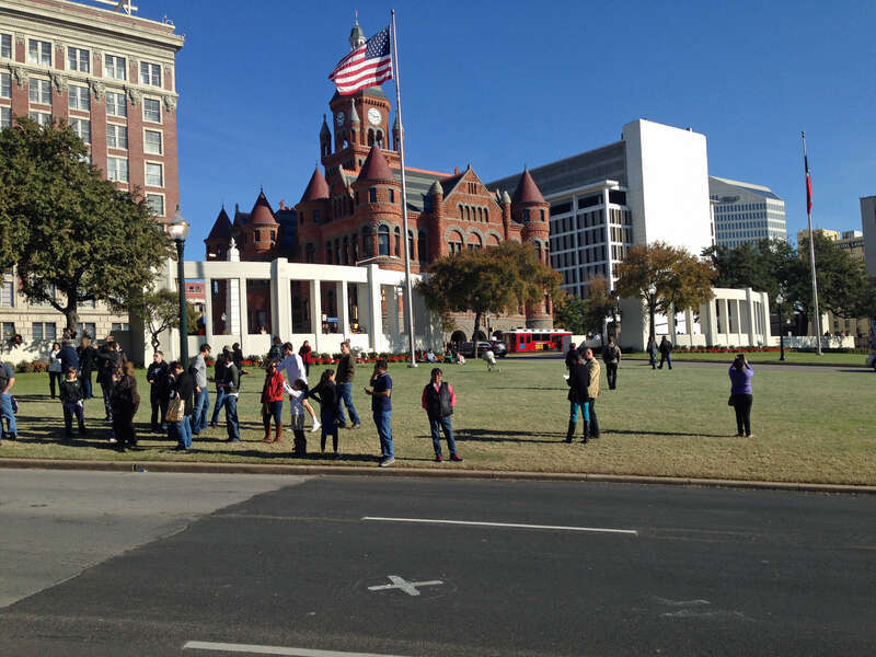 X marks the approximate location where John F. Kennedy was shot on Elm Street at Dealey Plaza in Dallas, Texas.