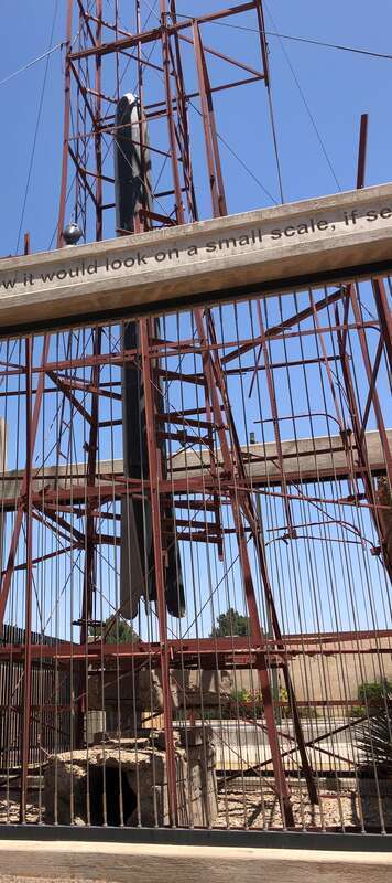 Dr. Goddards original launch tower with blast deflector below rocket engine - with rocket installed - at Roswell NM History museum 2 blast deflector