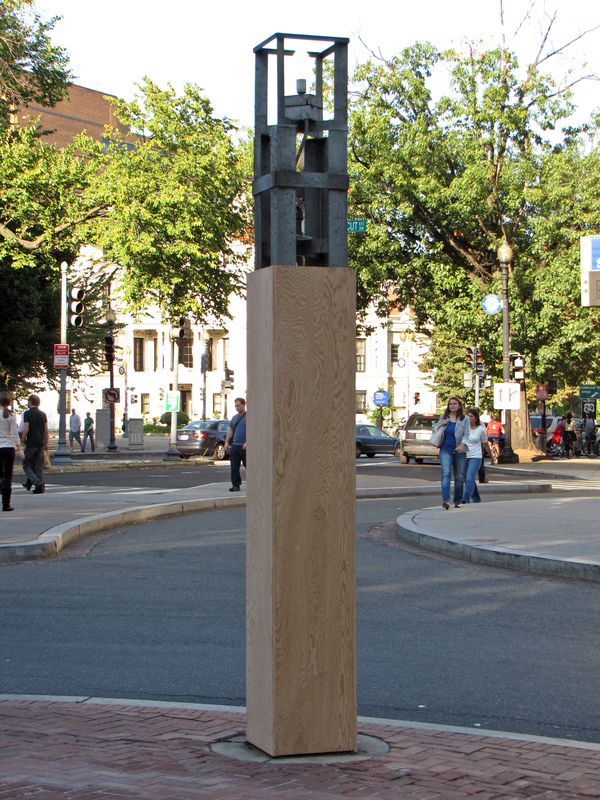 Pylon marking the south entrance of Dupont Circle station, stripped of its brown metal skin, leaving only the frame and the light bulb behind.  The frame was partially encased in plywood until the metal skin was reinstalled.

Ben Schumin is a