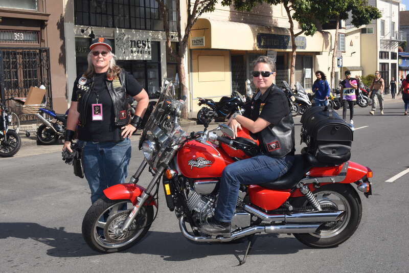 A couple of queer women pose for a photo by a motorcycle.
My theory; the Honda got them there reliably but the Harley broke down and is in the shop for repair.

YDD_1687