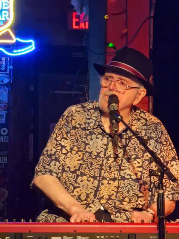 Closeup of Earl Poole Ball performing vocals and keyboard live at the Continental Club in Austin TX, age 83. He is playing a regular Saturday afternoon 3pm slot with one of his bands, Earl Poole Ball &amp;amp; Friends.