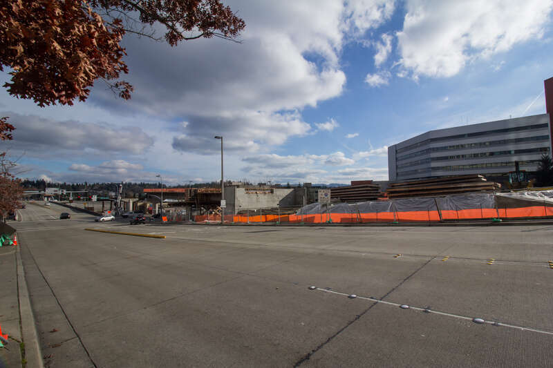 Looking at the site of the future Bellevue Downtown Station with Bellevue City Hall to the right and Interstate 405 in the distance