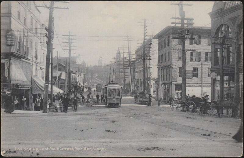 Undivided back postcard with a view of East Main Street in Meriden. Colony Street is at left, and several streetcars are visible at center.