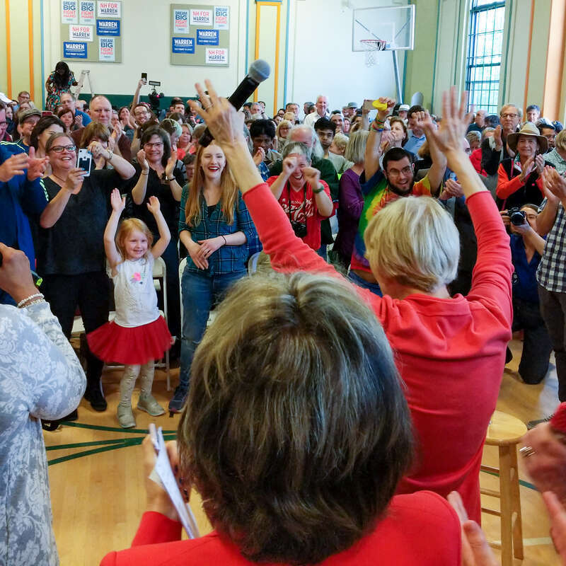 Elizabeth Warren dancing with little girl