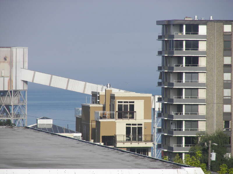 Elliott Bay in the distance, taken from the Mediterranean Inn at Queen Anne Ave. N and W Republican St. in the Lower Queen Anne neighborhood of Seattle.