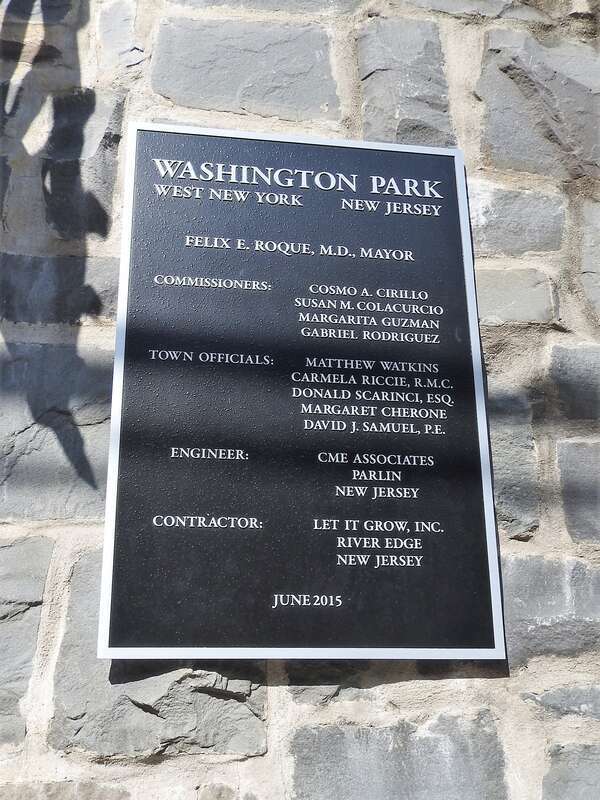 Looking north at plaque listing the politicians responsible for Washington Park