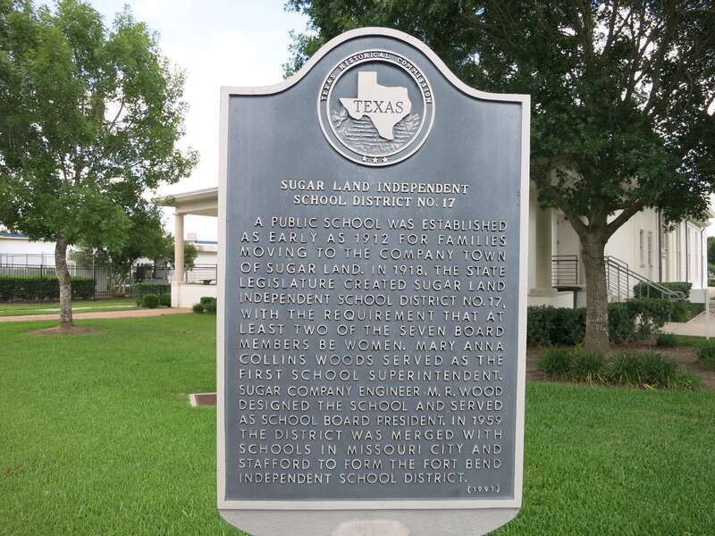 Photo shows a Texas Historical Commission marker for the former Sugar Land School District on the grounds of the Sugar Land Auditorium. It became part of the Fort Bend Independent School District in 1959. View is toward the southeast.