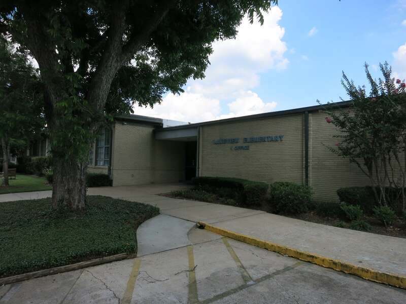 Photo shows Lakeview Elementary School at 314 Lakeview Drive, Sugar Land, TX 77498. It is part of the Fort Bend Independent School District. View is toward the southeast.