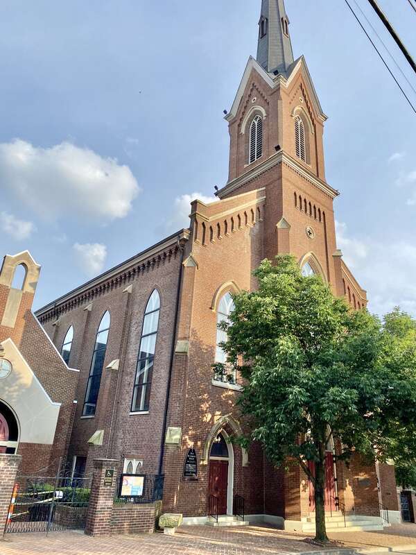 Built in 1874, this Gothic Revival-style building was designed by Cincinnatius Shryock for the congregation of the First Presbyterian Church of Lexington, founded as Mount Zion Church in 1784.  The building features a red brick exterior, a rough-hewn