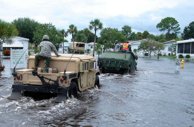 Members of the Florida National Guard's Delta Company, 1st Battalion, 124th Infantry Regiment, enter the Lamplighter Village mobile home park in Melbourne, Fla., to evacuate residents who request it, Aug. 21, 2008. Several residents were transported
