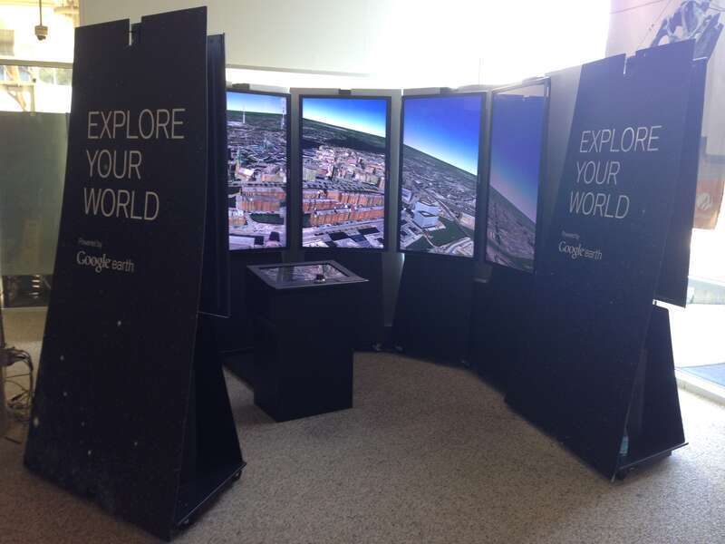 Interactive immersive Google Earth software projected on multiple monitors. In Googleplex building 43.