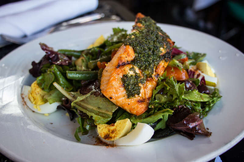 Michelle's entree at Ralph Brennan's Jazz Kitchen: Grilled Salmon Nicoise Salad - Green beans, spicy boiled egg, crispy potatoes, cherry tomatoes, calamata olives, honey balsamic vinaigrette.