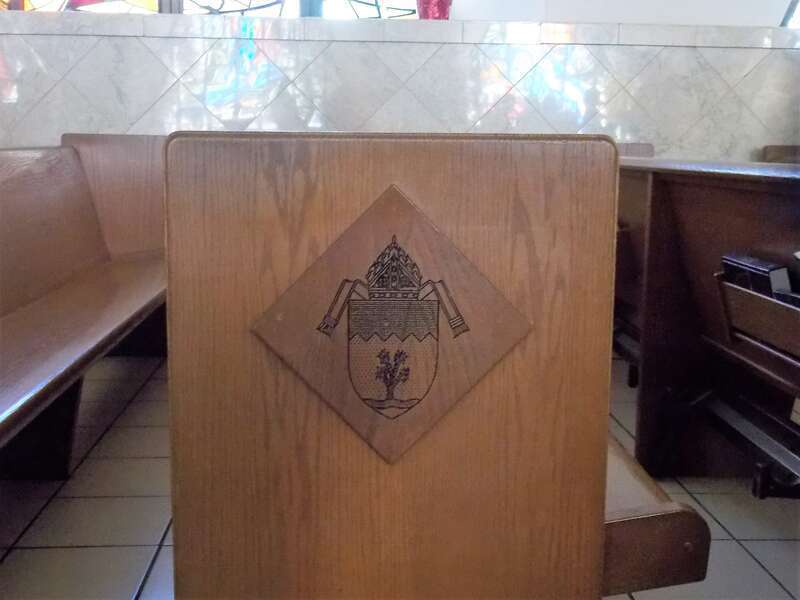 The pews ends in Guardian Angel Cathedral in Las Vegas feature a carved image of the diocesan coat of arms.