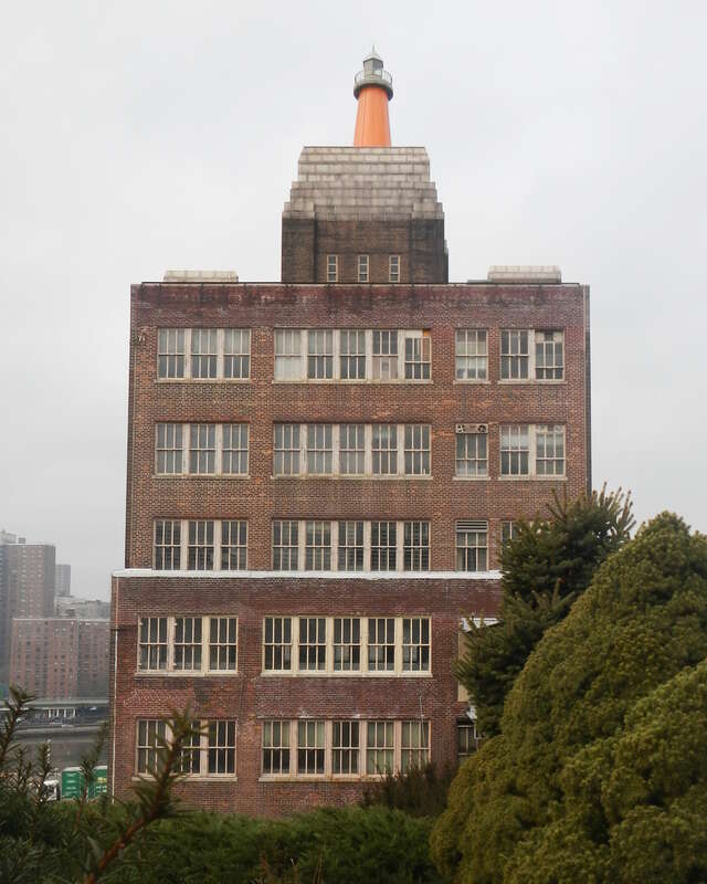 Looking west from Summit Avenue at former publisher, now self storage, on a cloudy day.
