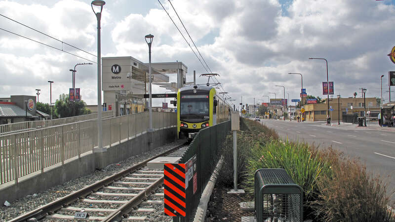 Looking south on Crenshaw Boulevard to Hyde Park station (LA Metro) at Crenshaw/Slauson, with K line train in November 2022.