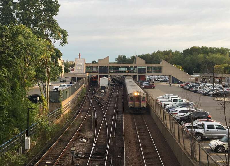 An inbound commuter rail train passes through Oak Grove station in September 2019