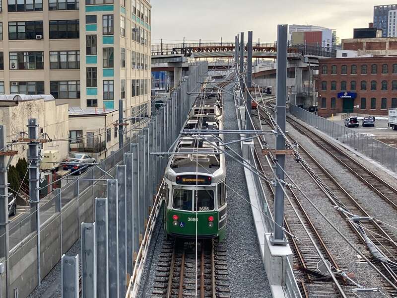 An inbound test train climbing the ramp onto Red Bridge in January 2022