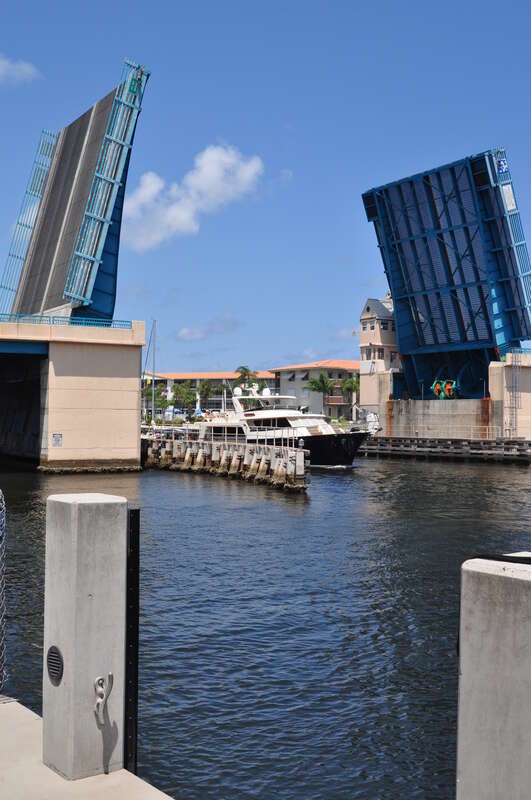 The J.D. Butler bascule bridge, carrying Florida State Road 810 over the Intercoastal Waterway, open to allow a vessel to pass through. Deerfield Beach, Florida.