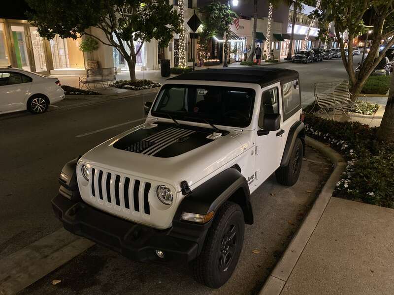 Jeep Wrangler Sport 2-door (finished in white) on Worth Avenue in Palm Beach, Florida.