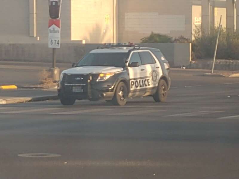 A 2013-'15 Ford Police Interceptor Utility of the Las Vegas Metropolitan Police Department stopped at the intersection of Maryland Parkway and Twain Avenue.