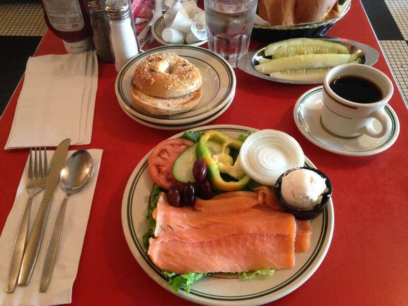 Nova lox, toasted sesame seed bagel, cream cheese, and optional toppings, before being assembled into a sandwich. This is the &quot;lox platter for one&quot; at The Bagel restaurant in Skokie, Illinois, United States.