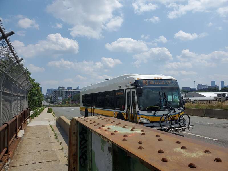 MBTA route 80 bus northbound on Squires Bridge in July 2021