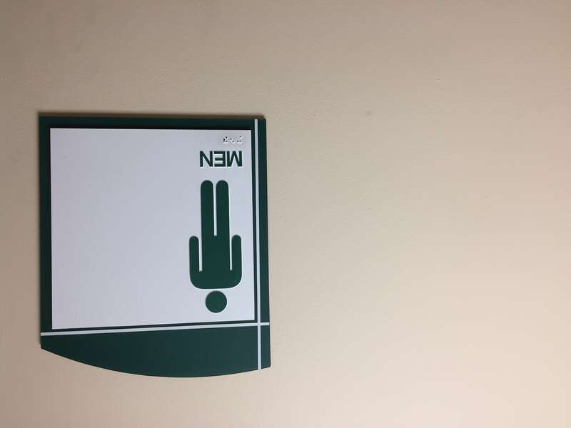 This men's restroom sign is displayed in a Southern, New Hampshire hospital.