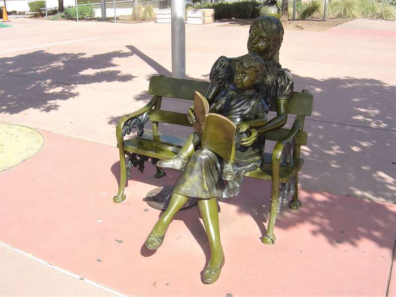 This statue depicts a mother helping her child to read at Morgan Hill Library.