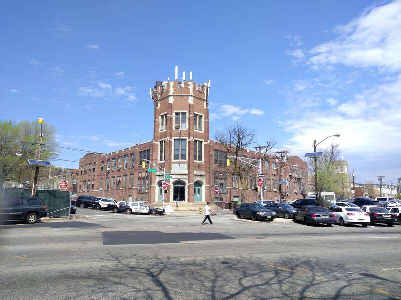 looking north across Broadway at Second Precinct on a sunny midday