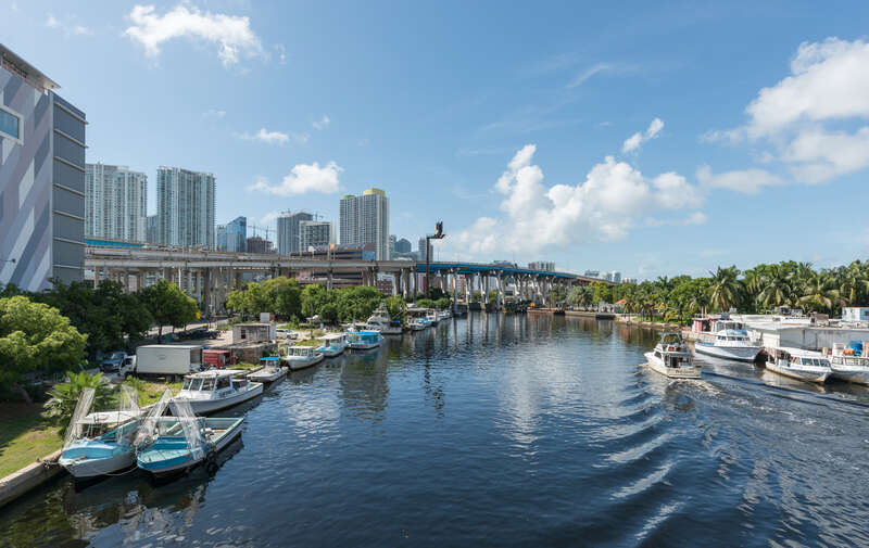 A north view of Miami and the Miami River, as seen from a bridge carrying 1st St