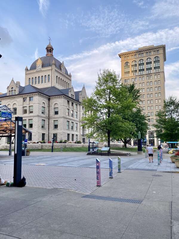 On the left, built in 1898-1900, this Richardsonian Romanesque Revival-style building was designed by Lehman and Schmitt to serve as the Fayette County Courthouse, and is the fifth courthouse to serve Fayette County, replacing a previous courthouse,