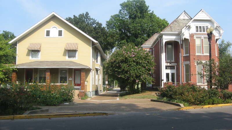 Houses on the eastern side of the 1100 block of S. Parrett Street in Evansville, Indiana, United States.  Built in 1910 (left) and 1885 (right), these houses are part of the Washington Avenue Historic District, a historic district that is listed on