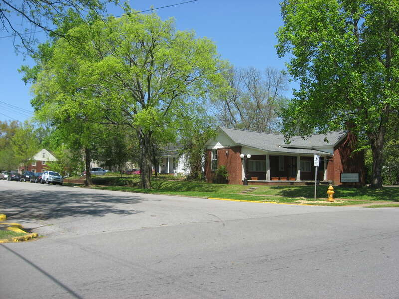 Houses on the eastern side of Poplar Street seen from the Tuscaloosa Street intersection in Florence, Alabama, United States.  This block is part of the Walnut Street Historic District, a historic district that is listed on the National Register of