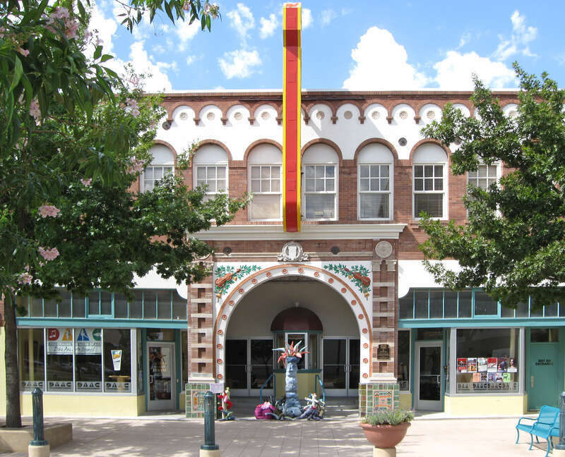 Rio Grande Theatre, a performing arts center located at 211 N. Downtown Mall in Las Cruces, New Mexico. Listed on the National Register of Historic Places, NRIS Item No. 03001352. The items in front of the arch are an installation, &quot;Rag Riparian&quot; by