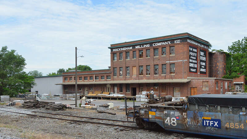 The front of the Rockingham Milling Company mill building, now being used by a lumber yard. Cheaasapeake Avenue, just south of West Bruce Street, Harrisonburg, Virginia.