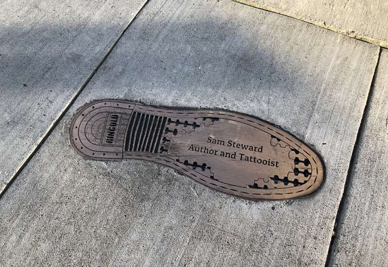 Bronze bootprint inlaid into the sidewalk in memory of Samuel Steward (&quot;author and tattooist&quot;), located in the San Francisco South of Market Leather History Alley.