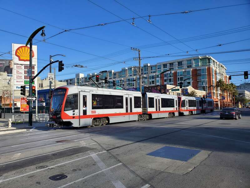 A northbound shuttle train crossing Bryant Street in November 2022 on the first day of passenger operations in the Central Subway