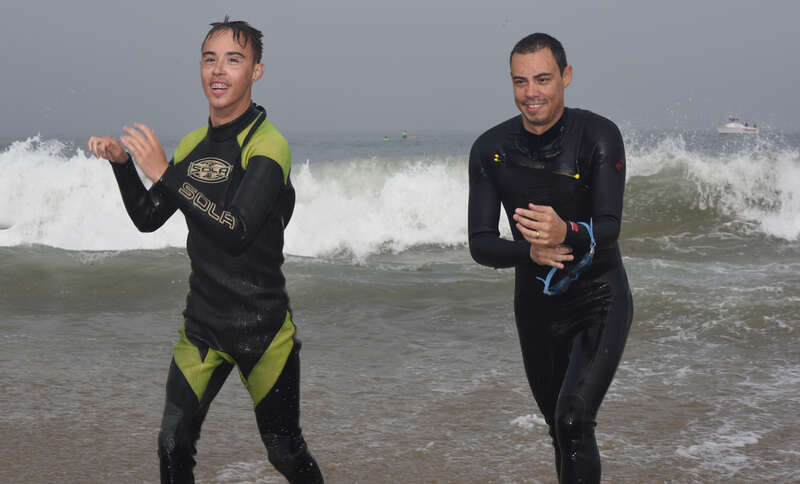 A son and father exit the water after swimming the Second Annual Redondo Beach Open Water Swim held on Sunday, July 14, 2019.

VFJ_0268_cln_cr